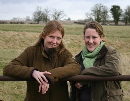 Two sisters, Lucy and Emma, outside in the countryside